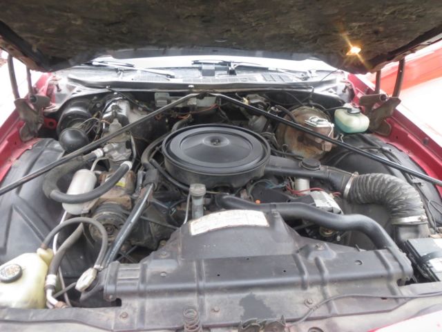 1976 Red Oldsmobile Cutlass Coupe