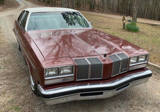 1976 Burgundy Oldsmobile Cutlass Sedan