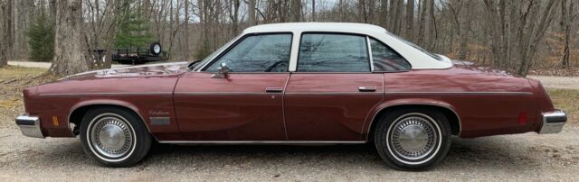 1976 Burgundy Oldsmobile Cutlass Sedan