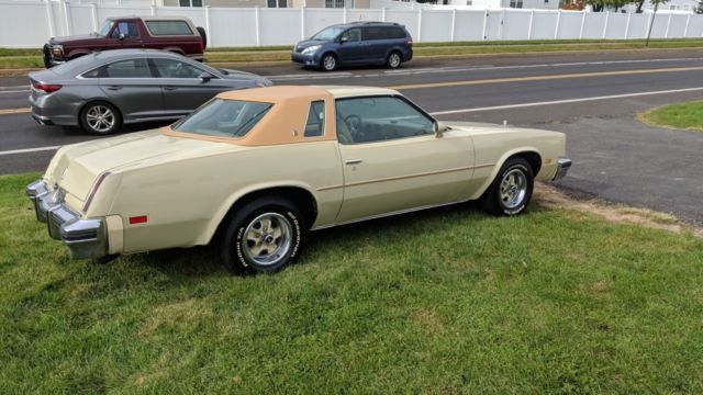 1976 cream/yellow Oldsmobile Cutlass