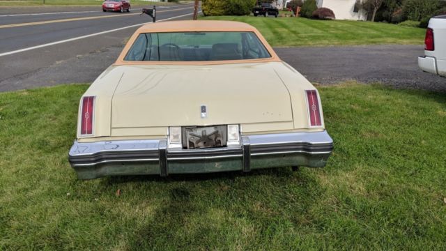 1976 cream/yellow Oldsmobile Cutlass