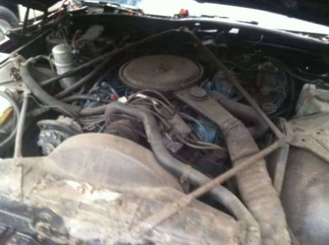 1977 Red Cadillac DeVille 2 door coupe