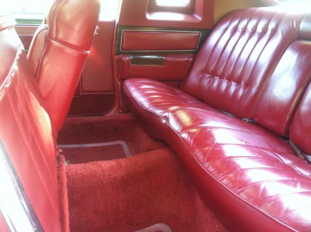1977 Red Cadillac DeVille 2 door coupe