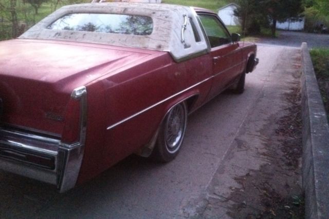 1977 Red Cadillac DeVille 2 door coupe