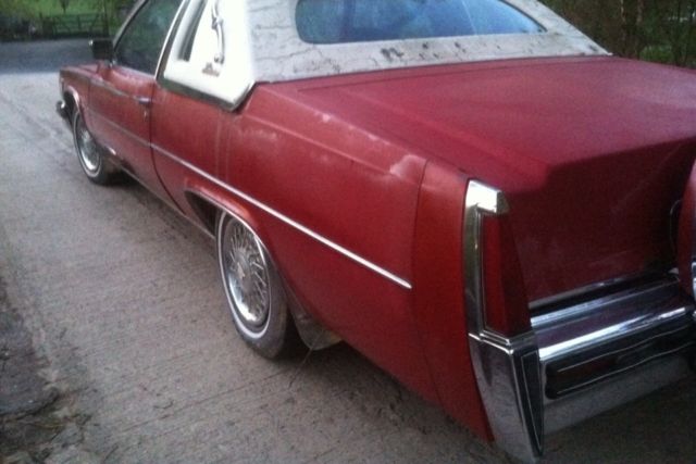 1977 Red Cadillac DeVille 2 door coupe