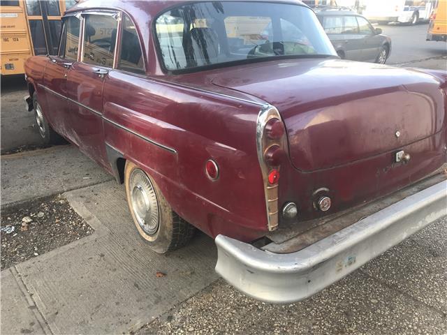 1977 maroon Chevrolet Bel Air/150/210 sedan
