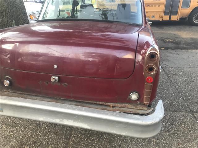 1977 maroon Chevrolet Bel Air/150/210 sedan