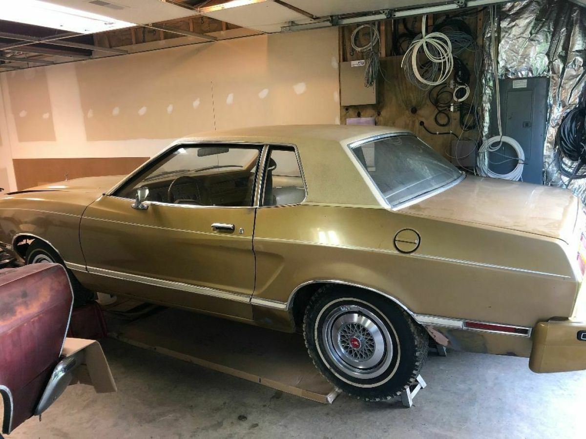 1977 gold Ford Mustang Coupe