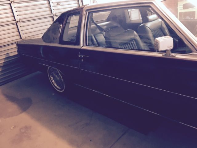 1979 black/silver Cadillac DeVille Coupe