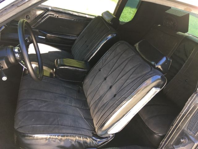 1979 Black metallic/ silver metallic Oldsmobile Cutlass Coupe