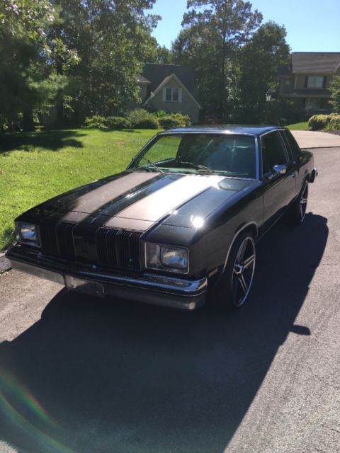 1979 Black metallic/ silver metallic Oldsmobile Cutlass Coupe