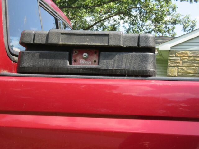 1979 Red Ford F-150 8 foot pickup bed