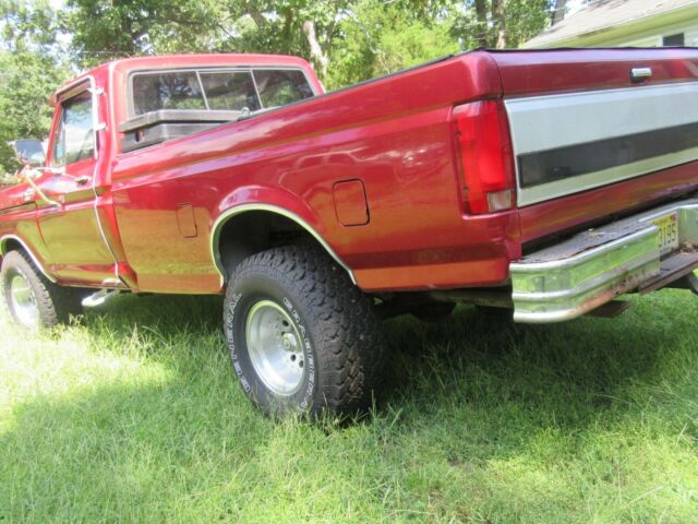 1979 Red Ford F-150 8 foot pickup bed
