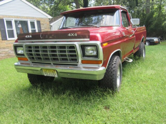 1979 Red Ford F-150 8 foot pickup bed