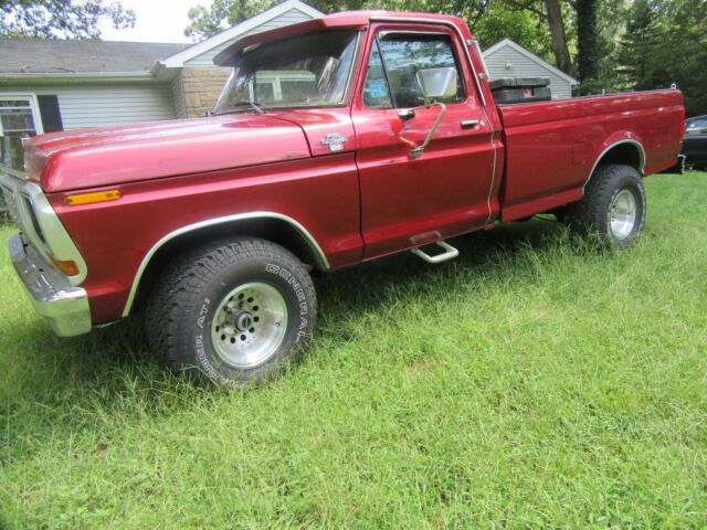 1979 Red Ford F-150 8 foot pickup bed