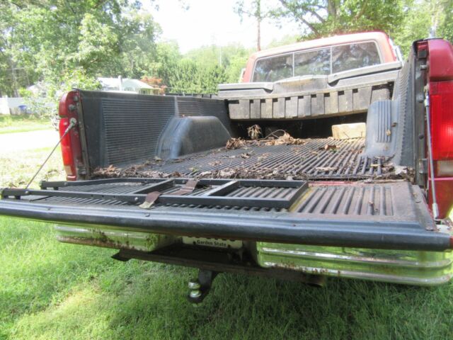 1979 Red Ford F-150 8 foot pickup bed
