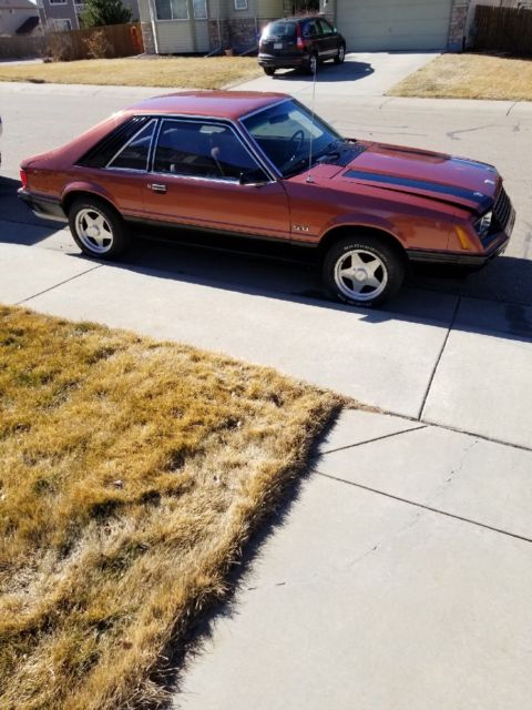 1979 Burnt orange Ford Mustang Hatchback