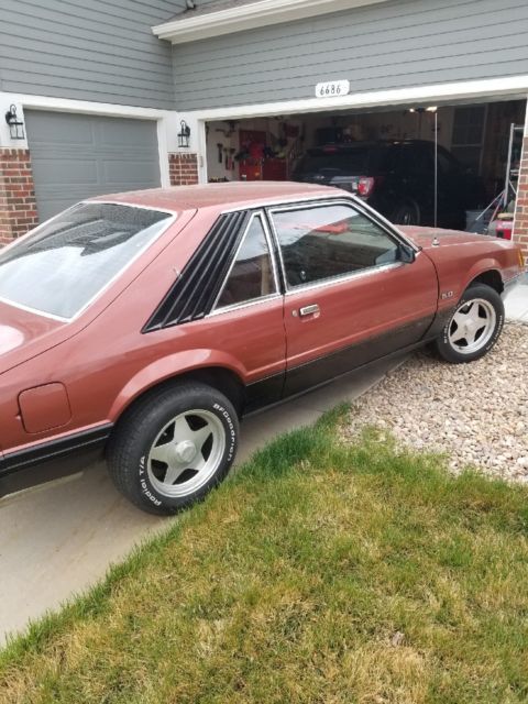1979 Burnt orange Ford Mustang Hatchback