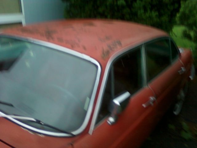 19790000 Red/Orange Jaguar XJ6 Sedan