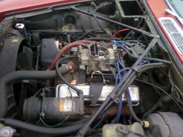 19790000 Red/Orange Jaguar XJ6 Sedan