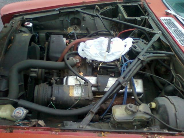 19790000 Red/Orange Jaguar XJ6 Sedan