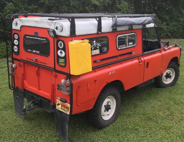1979 Orange Land Rover 109 hard top SUV