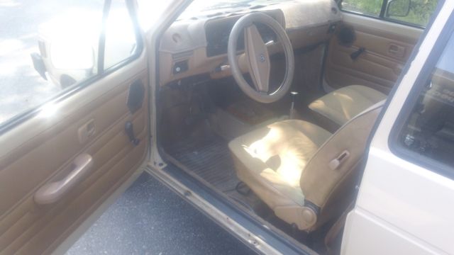 1980 tan Volkswagen Rabbit 2 door hatch
