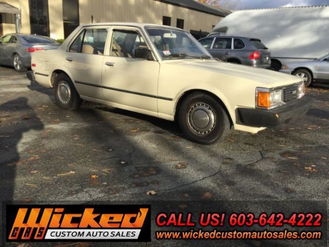 1981 beige Toyota Corona Sedan 4 Dr.