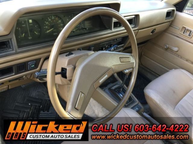 1981 beige Toyota Corona Sedan 4 Dr.
