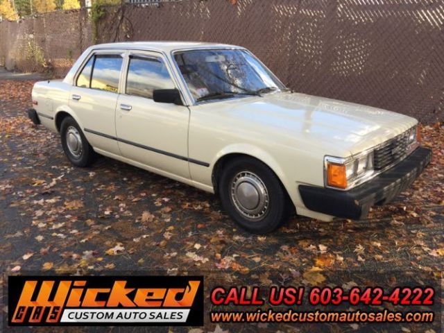 1981 beige Toyota Corona Sedan 4 Dr.