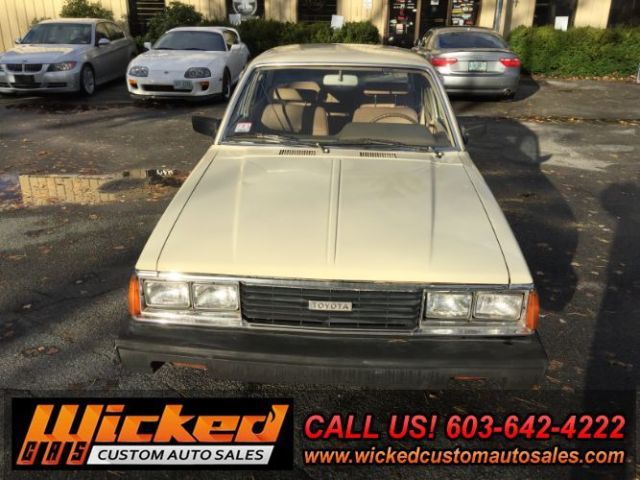 1981 beige Toyota Corona Sedan 4 Dr.