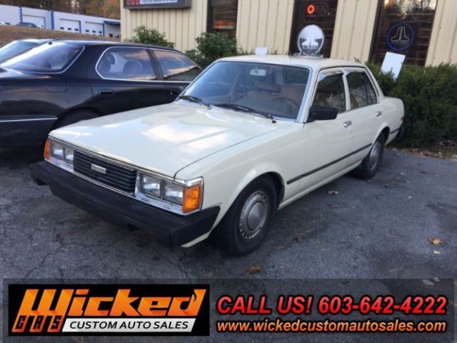1981 beige Toyota Corona Sedan 4 Dr.