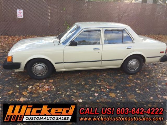 1981 beige Toyota Corona Sedan 4 Dr.