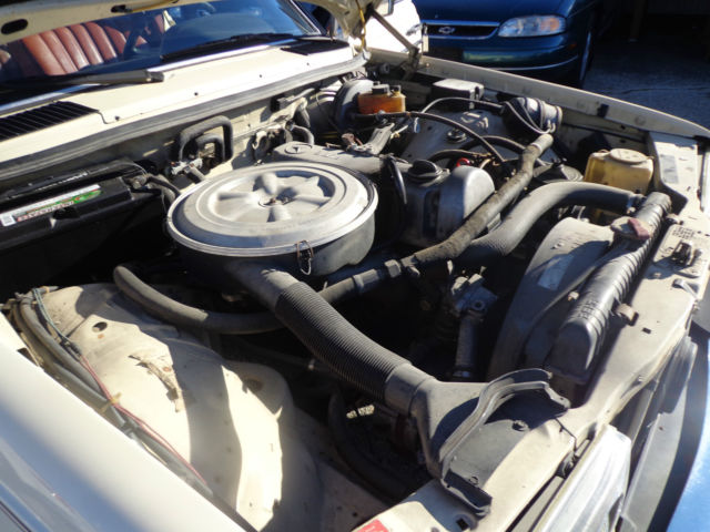 1981 cream Mercedes-Benz 200-Series Sedan