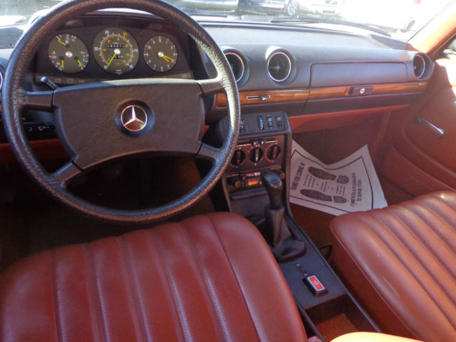 1981 cream Mercedes-Benz 200-Series Sedan