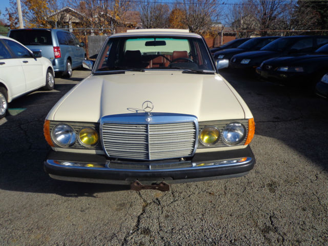 1981 cream Mercedes-Benz 200-Series Sedan