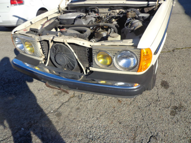 1981 cream Mercedes-Benz 200-Series Sedan