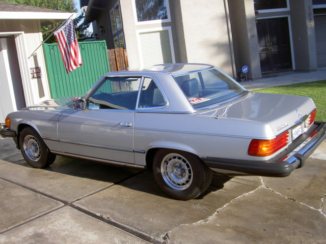 1982 silver Mercedes-Benz SL-Class 2 door roduster
