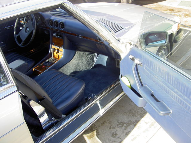 1982 silver Mercedes-Benz SL-Class 2 door roduster