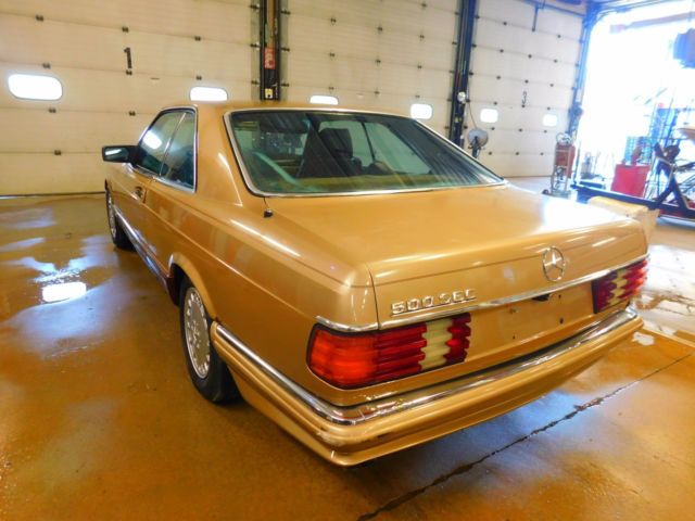 1982 Gold Mercedes-Benz 500-Series Sedan