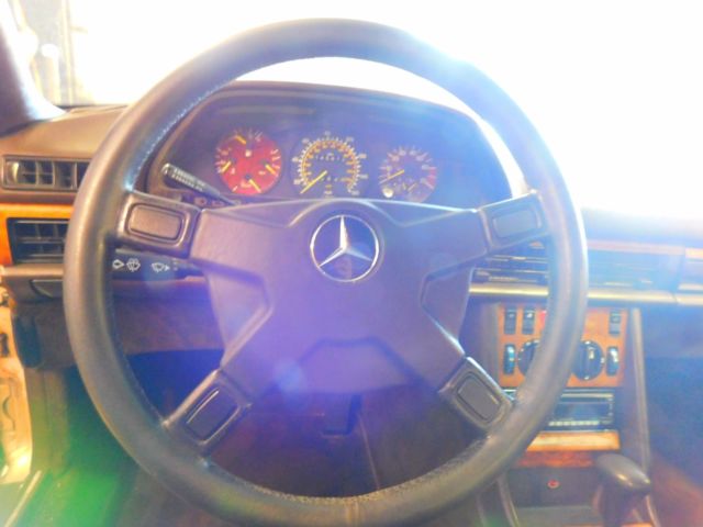 1982 Gold Mercedes-Benz 500-Series Sedan