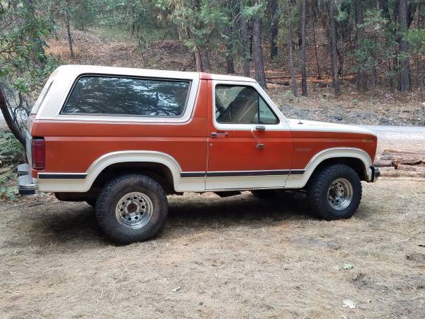 1983 red/white Ford Bronco SUV