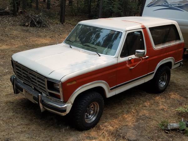 1983 red/white Ford Bronco SUV