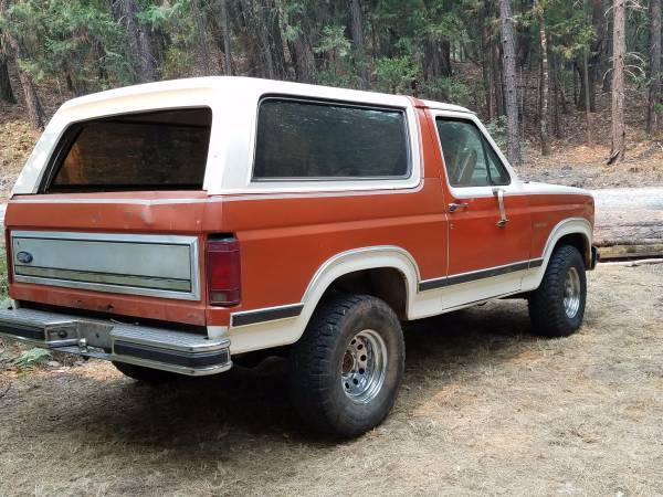 1983 red/white Ford Bronco SUV