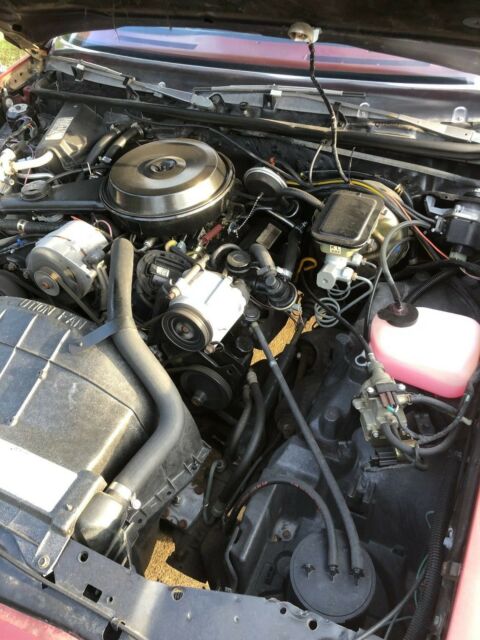 1983 maroon/black Chevrolet Malibu long roof