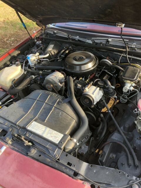 1983 maroon/black Chevrolet Malibu long roof