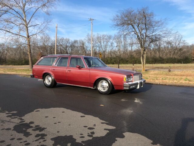 1983 maroon/black Chevrolet Malibu long roof