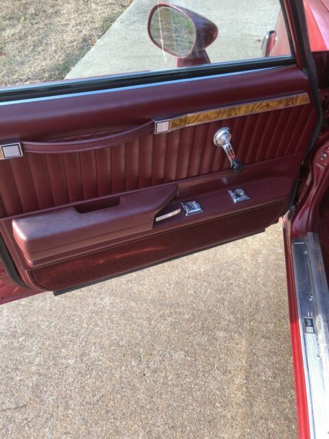 1983 maroon/black Chevrolet Malibu long roof