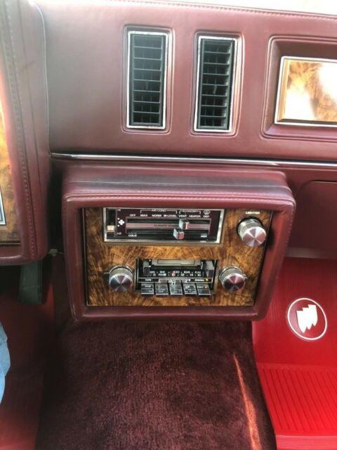 1983 maroon/black Chevrolet Malibu long roof