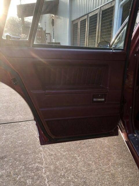 1983 maroon/black Chevrolet Malibu long roof